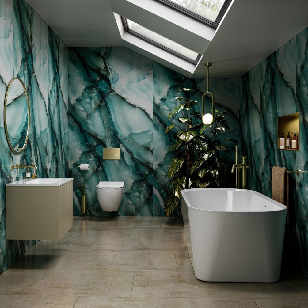 Lifestyle image of the Showerwall Laminate Onyx Ocean 2440mm x 579mm Proclick Hydrocore Wall Panel - SW97 installed across an entire bathroom wall with bath, toilet and vanity unit